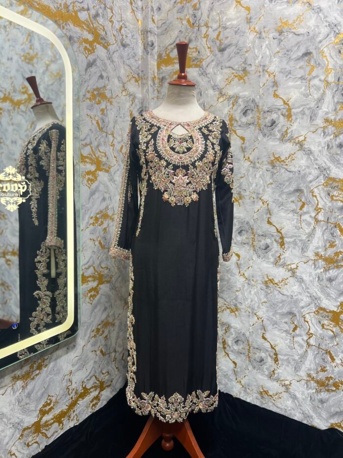 dress on tussel silk black color having work on neck and sleeves.